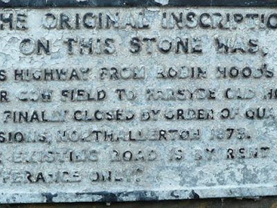Plaque giving inscription on adjacent stone, Albion Street