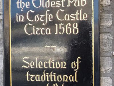 Sign outside Fox Inn, Corfe Castle, Dorset