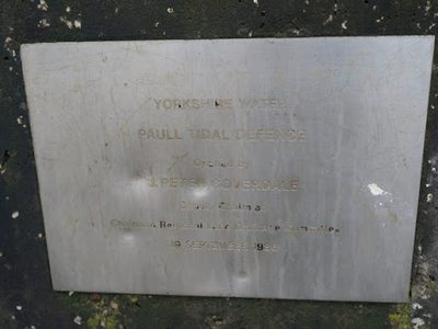 A plaque to the 1986 tidal defence wall. Paull
