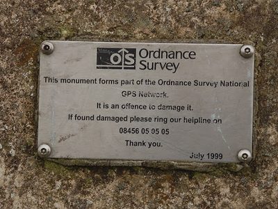 Plaque on the trig point column, High Street