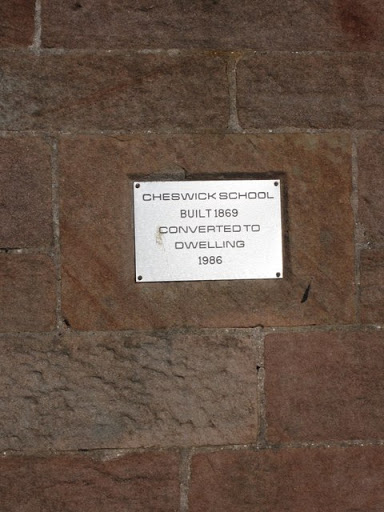 Plaque in wall of former Cheswick School