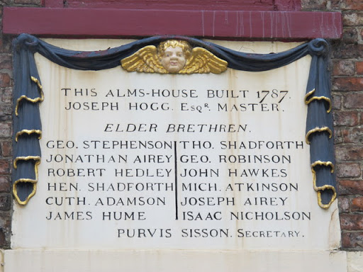 Plaque on the building on the west side of Trinity House Yard