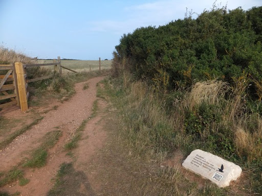 QR code on a plaque by the South West Coast Path