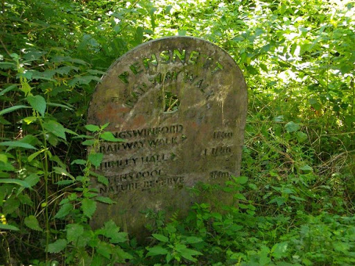 A plaque with distances on the Pensnett Railway Walk