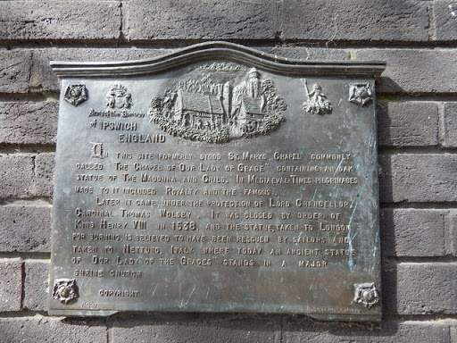 Plaque below Lady statue