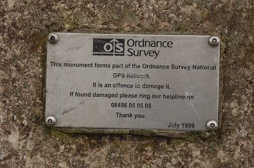 Plaque on the trig point column, High Street