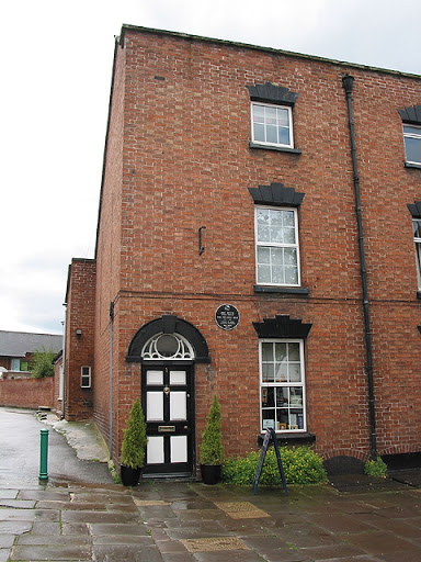 House with black plaque