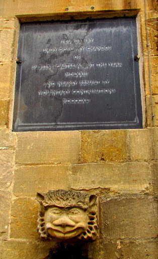 Chandos Almshouses plaque and gargoyle, Winchcombe