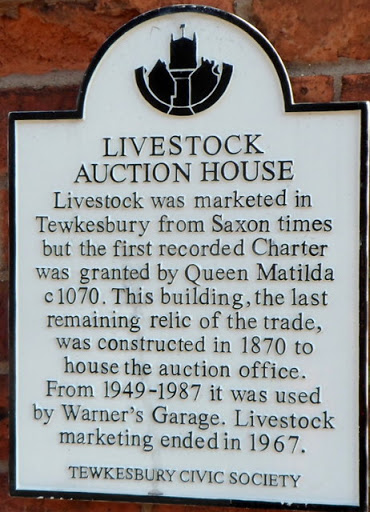 White plaque on the former livestock auction house, Tewkesbury